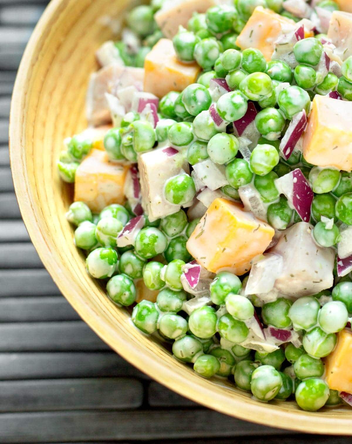 Creamy Pea Salad in a wood bowl