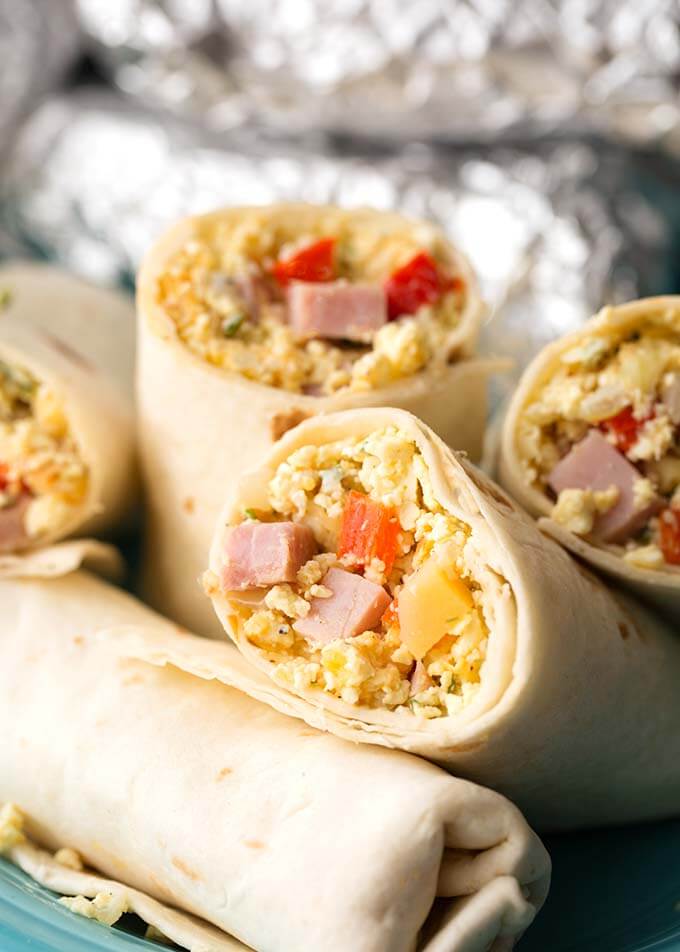 Closeup of Breakfast Burritos halves on a blue plate