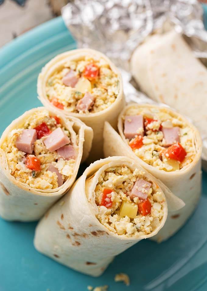 Breakfast Burritos cut in half on a blue plate