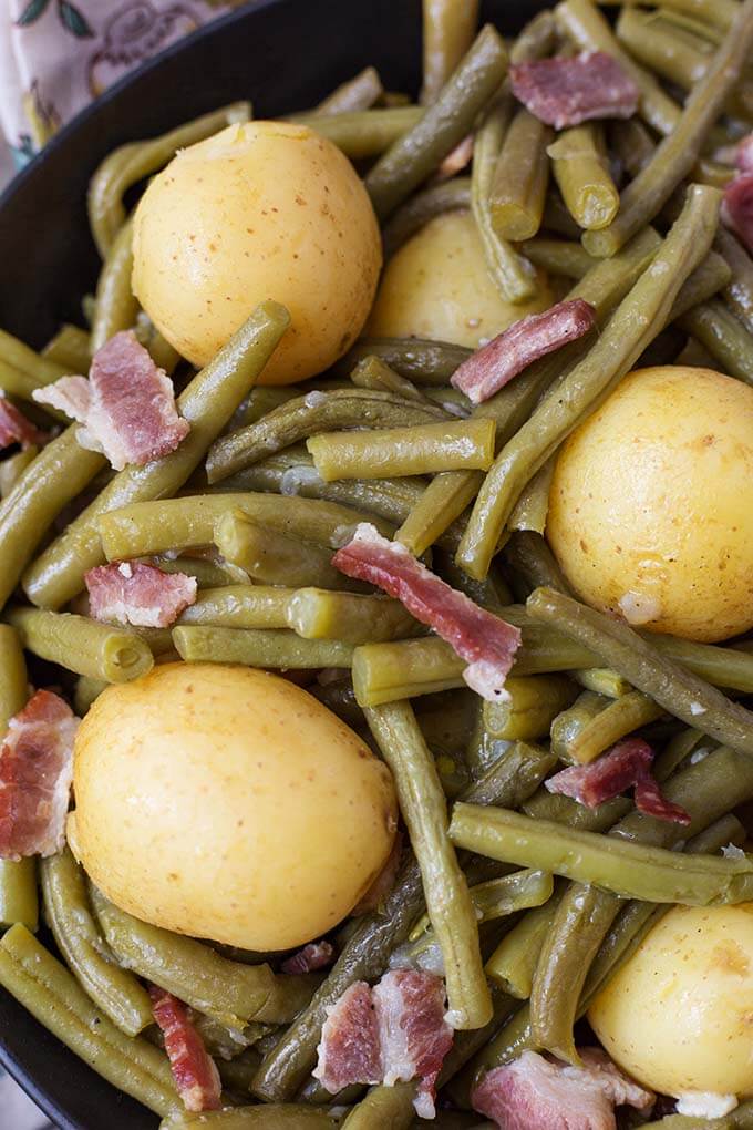 Closeup of Green Beans with New Potatoes and Bacon in a black bowl