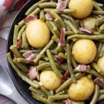 Instant Pot Green Beans with New Potatoes and Bacon are true comfort food! This fast cooking pressure cooker Southern green beans recipe is fast cooking, and has a lot of flavor. simplyhappyfoodie.com #instantpotrecipes #southerngreenbeans #instantpotgreenbeans #pressurecookergreenbeanspotatoesbacon Instant Pot Recipes