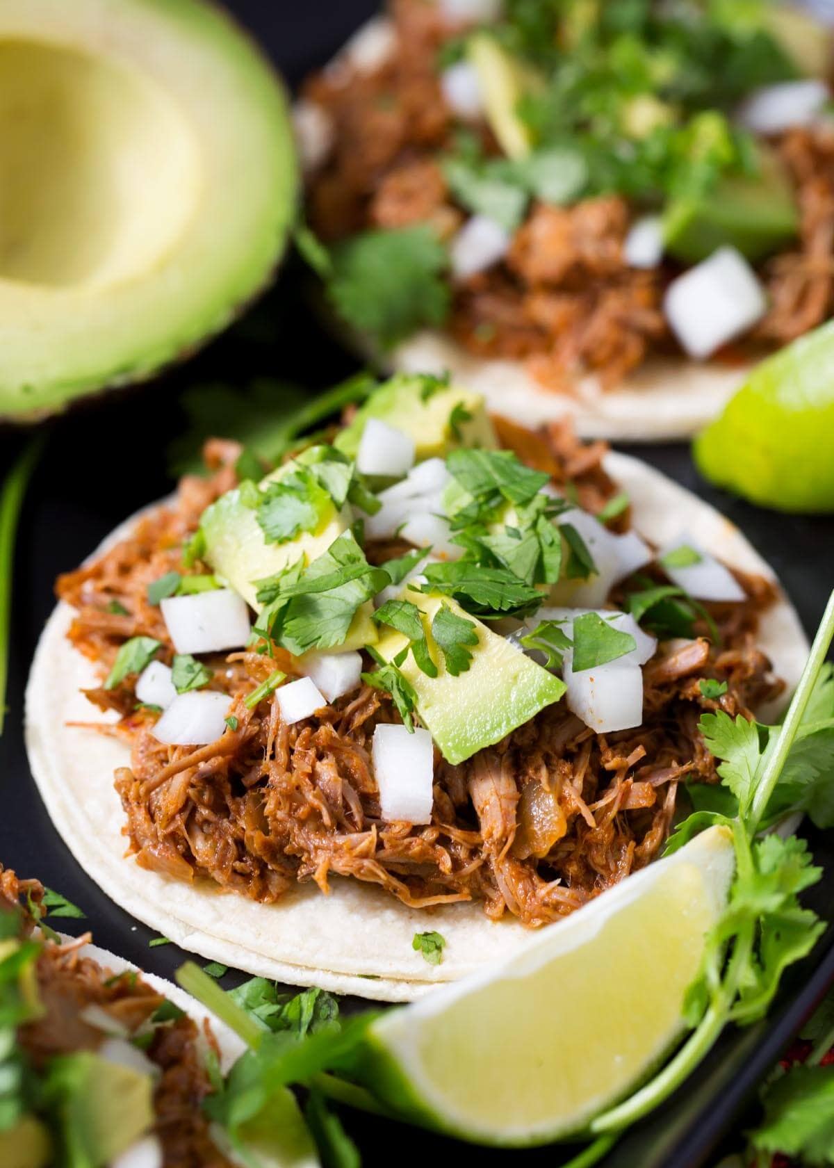 Slow Cooker Barbacoa Beef on a tortilla