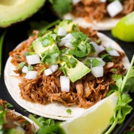 Slow Cooker Barbacoa Beef on a tortilla
