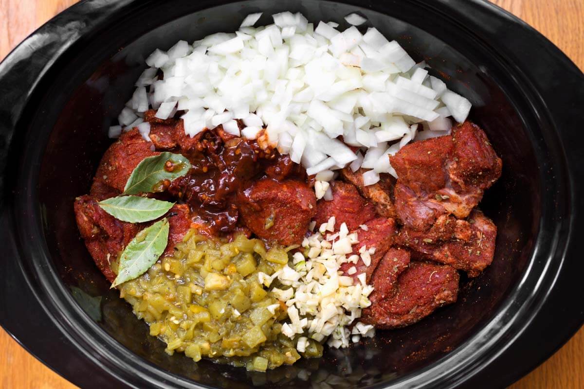 Slow Cooker Barbacoa Beef ingreadients shot in crock