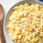 Slow Cooker Creamed Corn in a white bowl