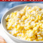 Slow Cooker Creamed Corn in a white bowl