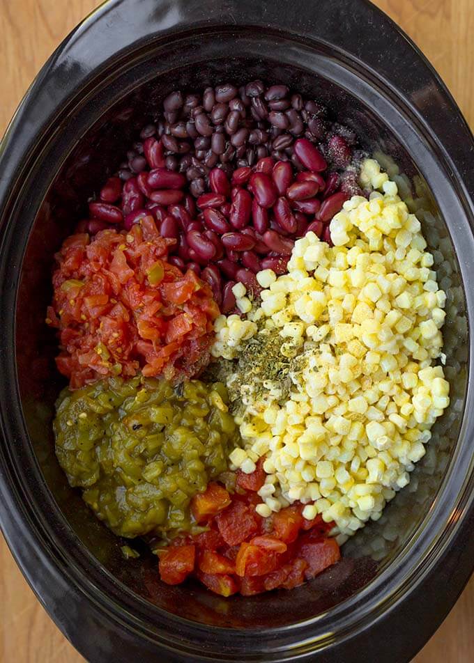 Ingredients for Taco Soup i a black slow cooker