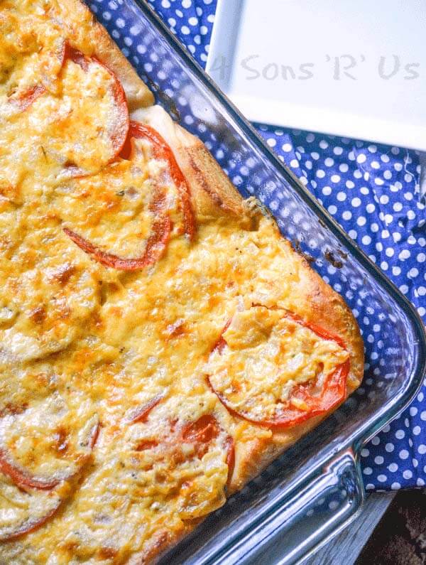 Cheesy Tomato Biscuit Casserole in a glass baking dish