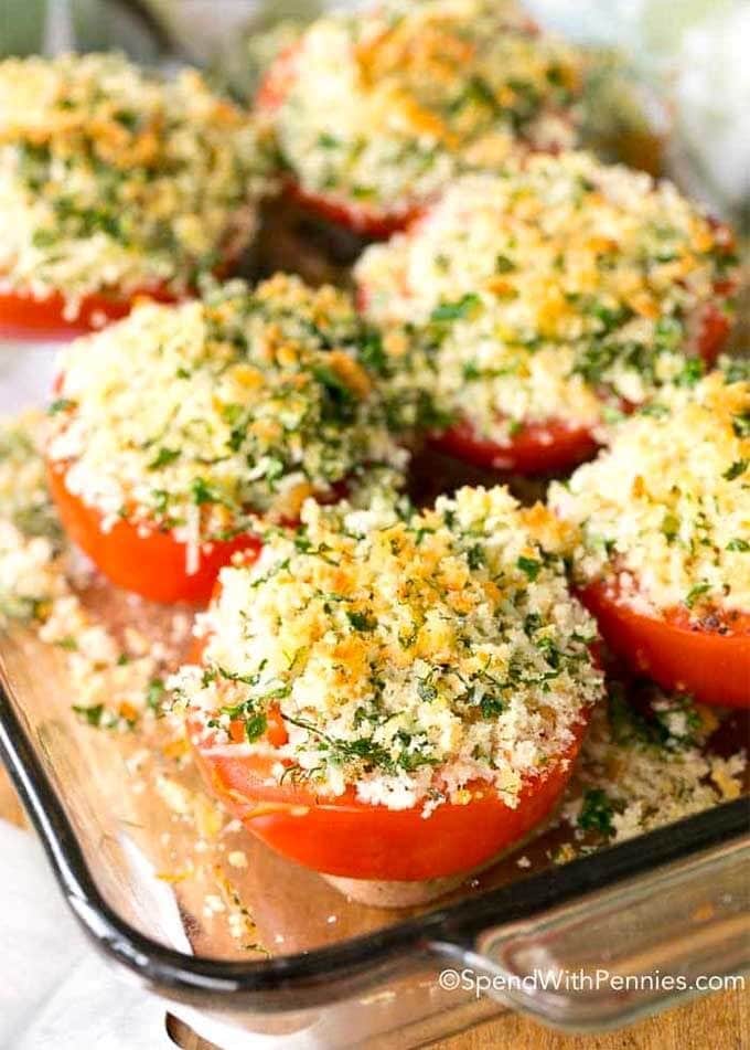 Six Herb Crusted Baked Tomatoes on a wooden board