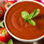 Marinara Fresh Tomato Sauce in a white bowl topped with fresh basil