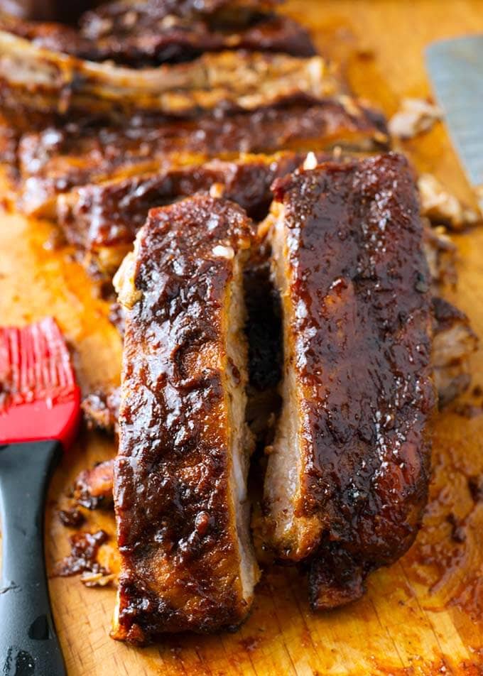 Close up of sliced slow cooker Ribs on a cutting board