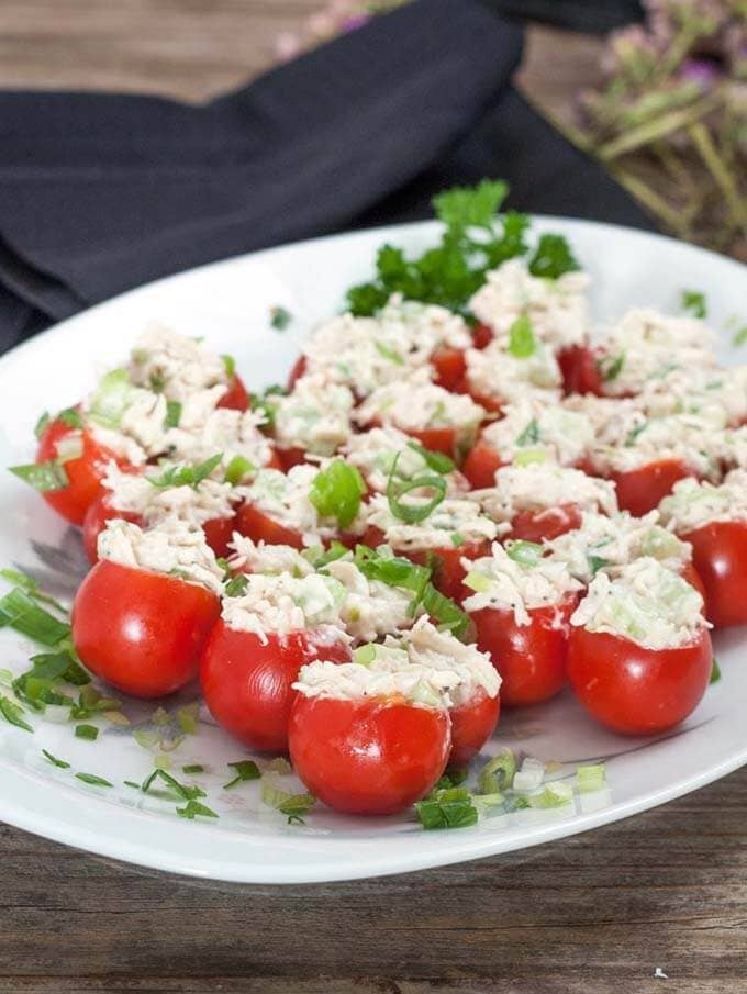 several tomato bites on a white platter