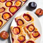 Fresh Plum Cake Pflaumenkuchen slices o a white plate