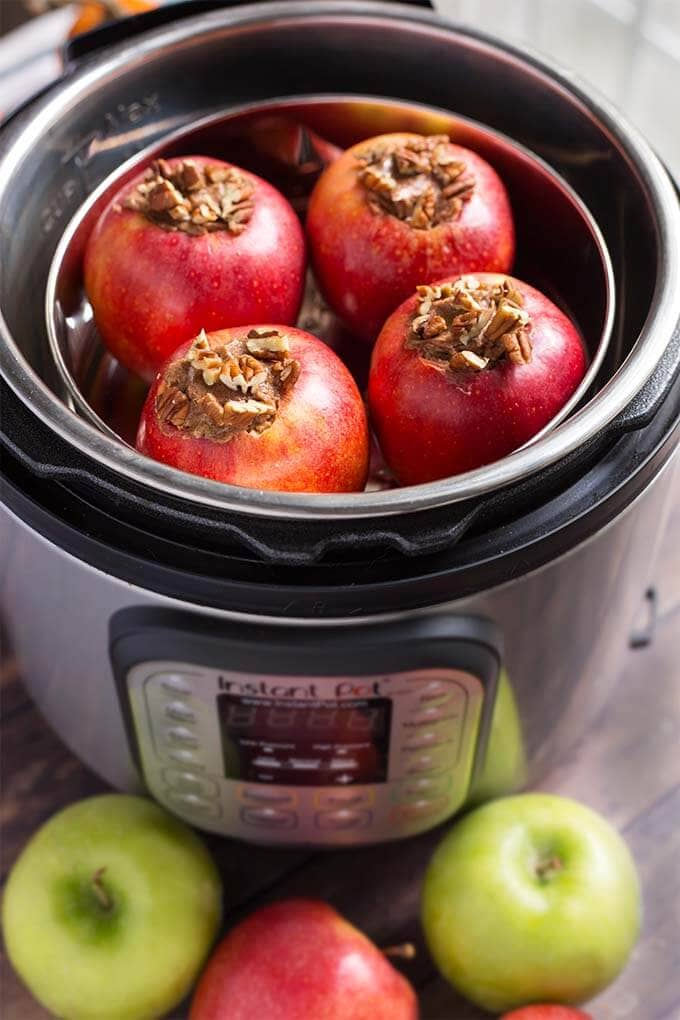 Four Baked Apples in a pot inside of the pressure cooker