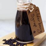 Elderberry Syrup in a small bottle with a tag tied with twine