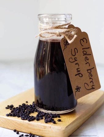 Elderberry Syrup in a small bottle with a tag tied with twine