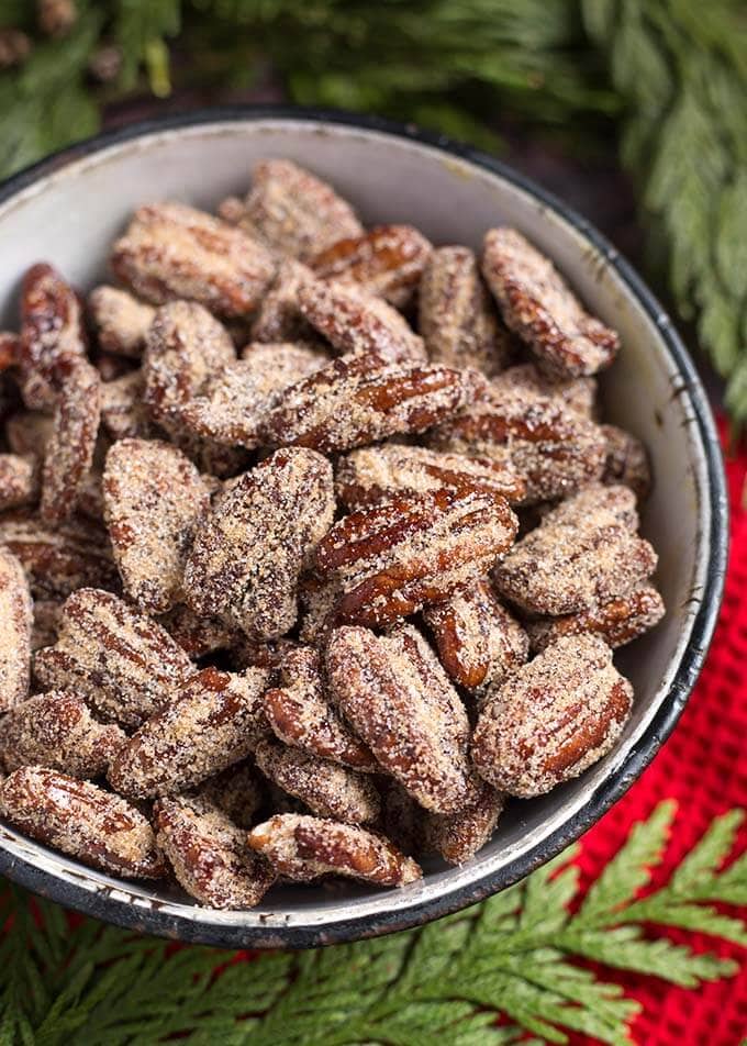 Maple Candied Pecans in a white bowl with a black rim