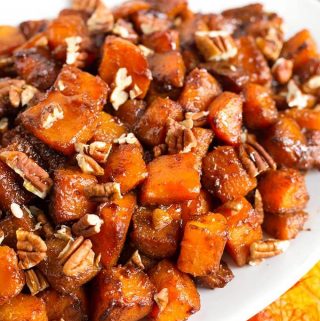 Closeup of Cinnamon Roasted Butternut Squash on a white oblong platter