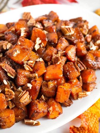 Closeup of Cinnamon Roasted Butternut Squash on a white oblong platter