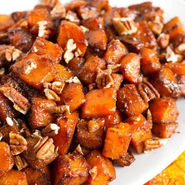 Closeup of Cinnamon Roasted Butternut Squash on a white oblong platter