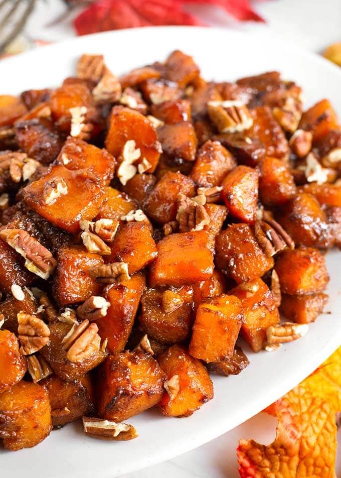 Closeup of Cinnamon Roasted Butternut Squash on a white oblong platter