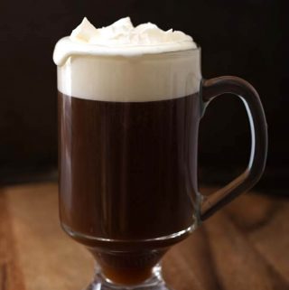 Classic Irish Coffee Recipe in a glass on a wooden board