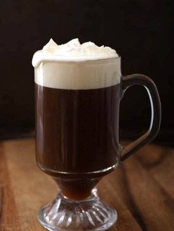 Classic Irish Coffee Recipe in a glass on a wooden board