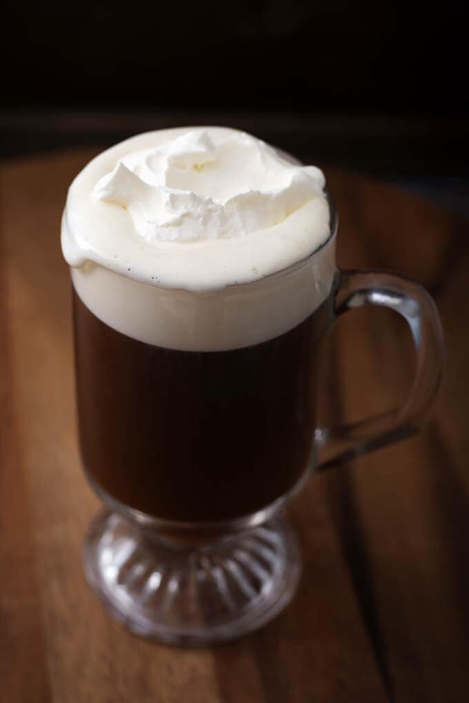 Classic Irish Coffee Recipe in a glass on a wooden board