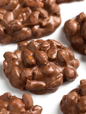 Chocolate Peanut Clusters on parchment paper