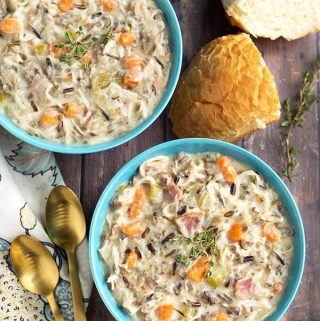 Crock Pot Creamy Chicken Wild Rice Soup is delicious, thick, rich, and so simple to make! Slow cooker creamy chicken wild rice soup is a hearty one pot meal that is perfect for Fall. My whole family loves this soup! simplyhappyfoodie.com #wildricesoup #crockpotchickenwildricesoup #slowcookerwildricesoup