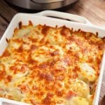 Scalloped Potatoes in a white square baking dish