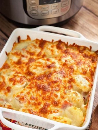 Scalloped Potatoes in a white square baking dish