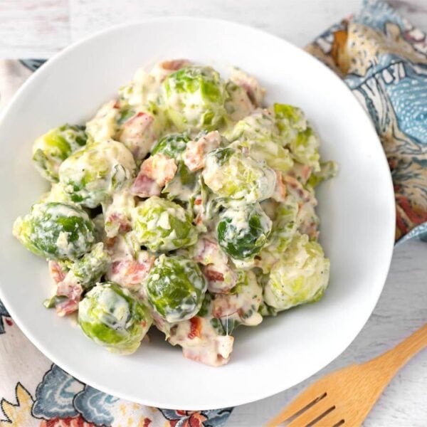 Instant Pot Creamy Bacon Brussels Sprouts in a white bowl