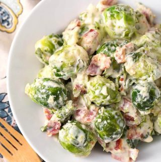 Instant Pot Creamy Bacon Brussels Sprouts are so delicious you might end up converting someone who doesn't like Brussels Sprouts! These are savory, creamy, and just the perfect texture. Pressure Cooker Creamy Bacon Brussels Sprouts are a perfect side dish for Thanksgiving, or any Holiday or special occasion. You can make these Instant Pot brussels sprouts any time! Instant Pot Recipes by simplyhappyfoodie.com #instantpotbrusselssprouts #pressurecookerbrusselssprouts #instantpotbrusselssproutsbacon