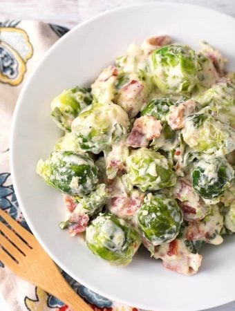 Creamy Bacon Brussels Sprouts on a white plate