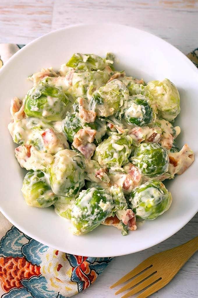 Creamy Bacon Brussels Sprouts on a white plate