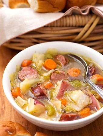 Instant Pot Kielbasa Cabbage Potato Soup is a Fall soup if ever there was one! This simple and rustic soup has a rich broth and chunky carrots, green cabbage, and tasty smoked kielbasa. This pressure cooker Kielbasa Cabbage Potato Soup recipe is one of my family's favorites! simplyhappyfoodie.com #instantpotrecipes #instantpotsoup #instantpotcabbagepotatosoup #pressurecookersoup