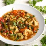 Instant Pot Vegetable Tortellini Soup is delicious, vegetarian, and full of healthy veggies in a rich and flavorful broth. The cheese tortellini has a nice texture. This pressure cooker vegetable tortellini soup is a vegetarian delight! Instant pot soup recipes and Instant Pot recipes by simplyhappyfoodie.com #instantpotvegetablesoup #instantpotvegetabletortellinisoup