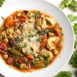 Instant Pot Vegetable Tortellini Soup is delicious, vegetarian, and full of healthy veggies in a rich and flavorful broth. The cheese tortellini has a nice texture. This pressure cooker vegetable tortellini soup is a vegetarian delight! Instant pot soup recipes and Instant Pot recipes by simplyhappyfoodie.com #instantpotvegetablesoup #instantpotvegetabletortellinisoup