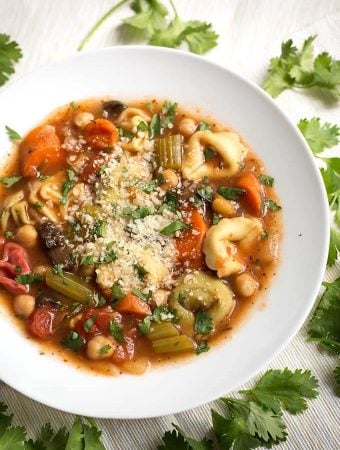 Vegetable Tortellini Soup in a white bowl