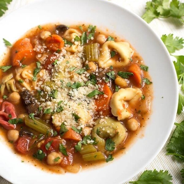 Vegetable Tortellini Soup in a white bowl