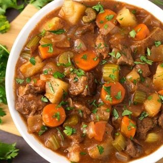 Classic Slow Cooker Beef Stew tastes just like the stew my mom used to make. No need for packaged soups in this comforting slow cooker beef stew. This recipe makes a lot, so you can feed a crowd! The best crock pot beef stew recipe by simplyhappyfoodie.com #slowcookerbeefstew #crockpotbeefstew