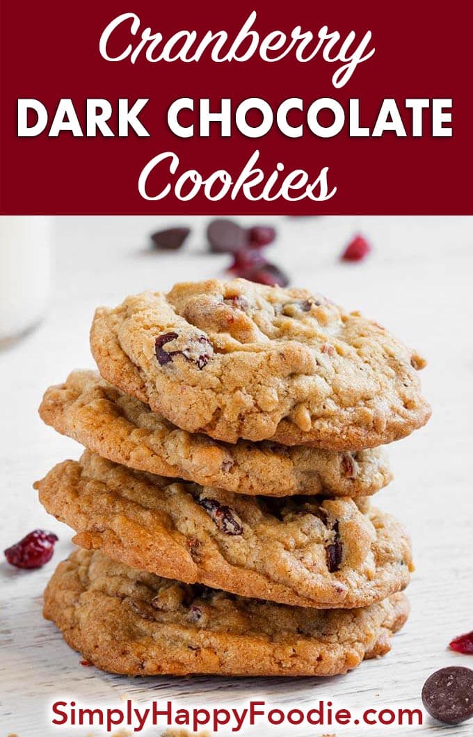 Cranberry Dark Chocolate Cookies are a sweet and slightly tart cookie. The dried cranberries accent the delicious dark chocolate and oatmeal in this tasty cookie recipe. These cookies are perfect for a Holiday cookie exchange! simplyhappyfoodie.com #cranberrydarkchocolatecookies #holidaycookies