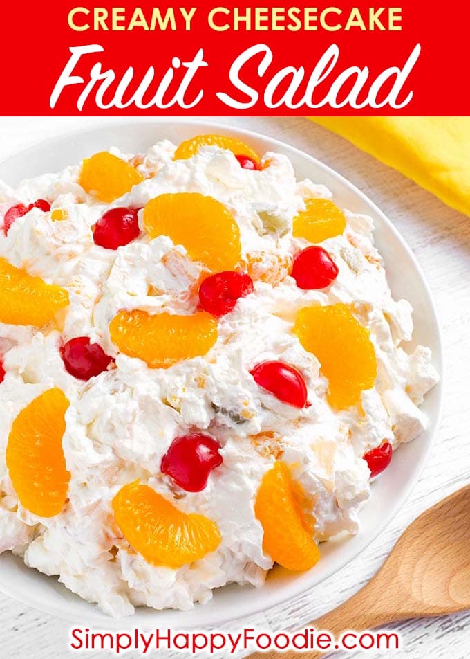 Creamy Cheesecake Fruit Salad is extra creamy, and not too sweet. This is a very easy fruit salad to make, with only 4 ingredients! This is our favorite Holiday and special occasion fruit salad recipe. simplyhappyfoodie.com #fruitsalad #creamyfruitsalad