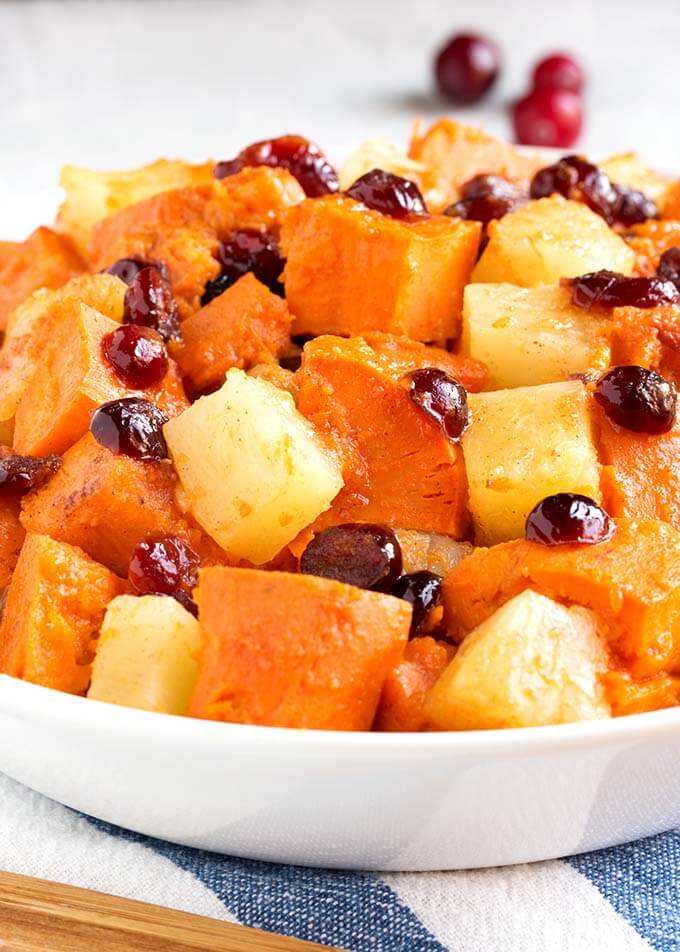 Close up of Sweet Potato Cranberry Casserole in a white bowl