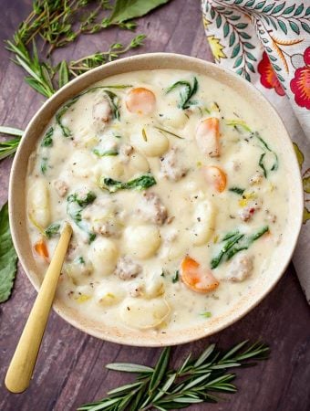 Creamy Sausage Gnocchi Soup in a beige bowl