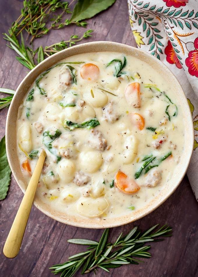 Creamy Sausage Gnocchi Soup in a beige bowl