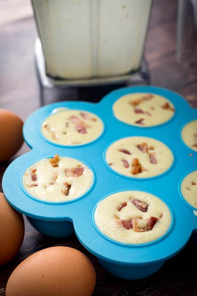 uncooked Egg Bites in a blue pressure cooker mold