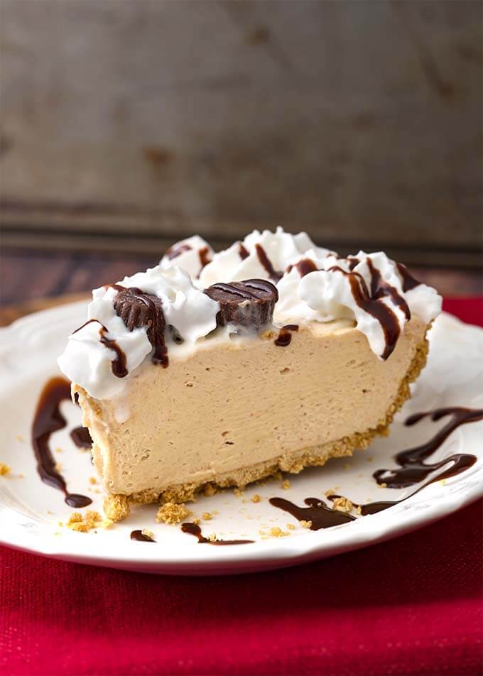 Slice of No Bake Peanut Butter Pie on a white plate