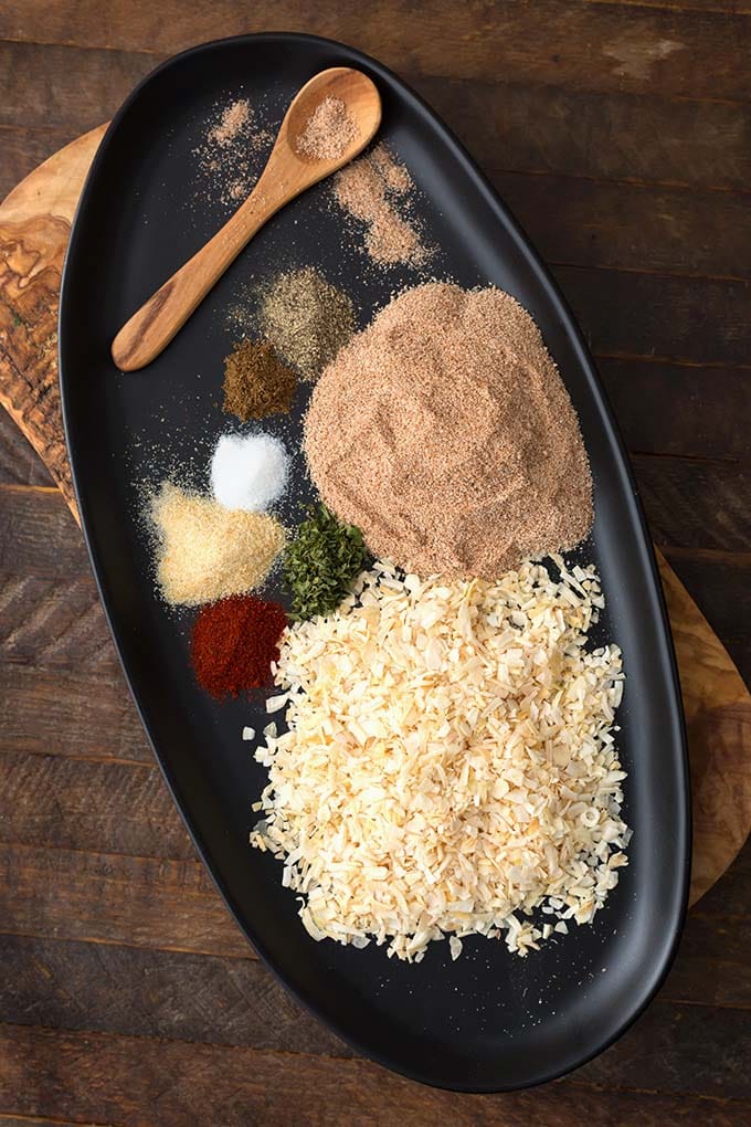 Ingredients for Homemade Onion Soup Mix on a black oblong platter